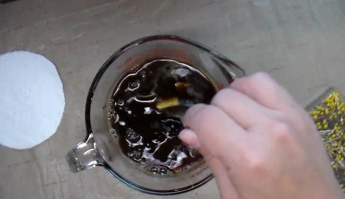 Dip cotton fabric petals into instant coffee, squeeze, and let dry.