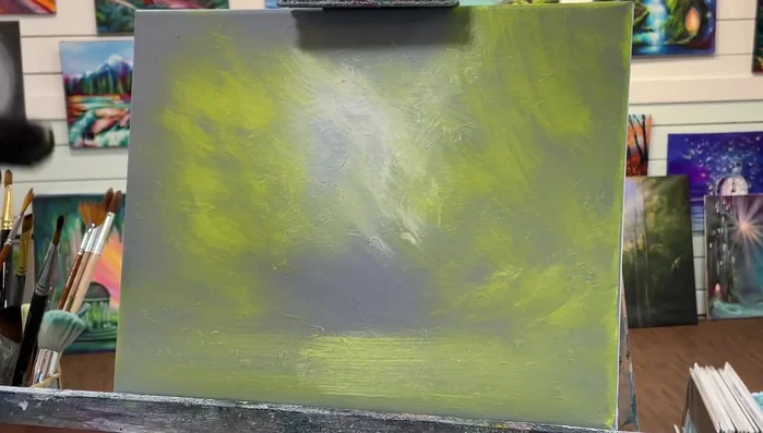 Using a mix of yellow and black, create a dark olive green and stipple in for trees, working from the outer edges inward.