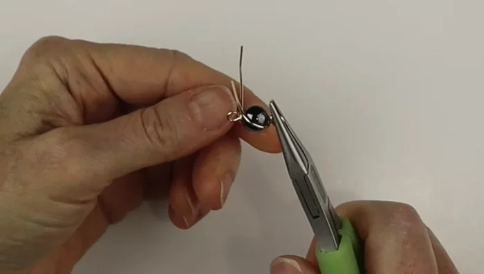 Straighten out the loops using flat pliers.