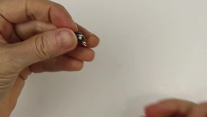Straighten out the loops using flat pliers.