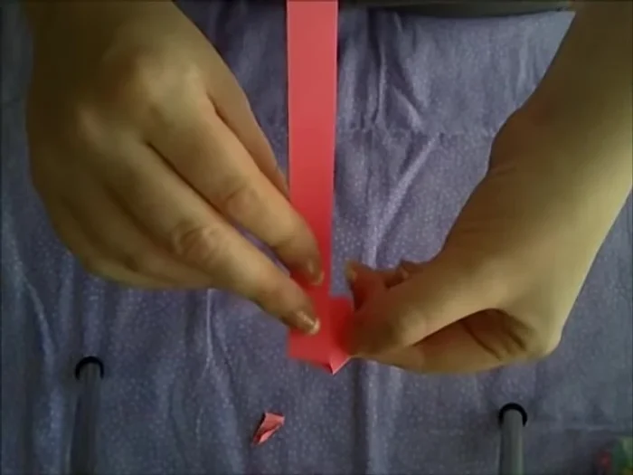 Fold the little tail repeatedly in the same pattern, but not too tightly.