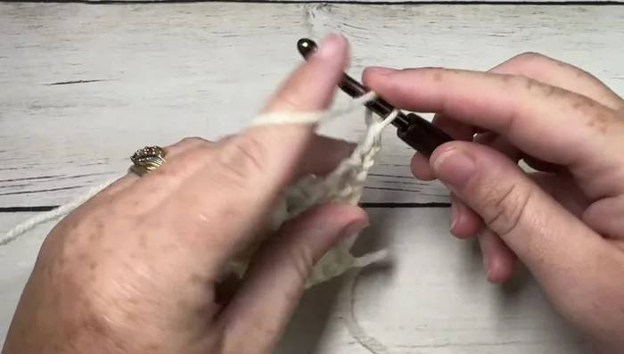 Repeat Rows 3-6 until the scarf measures approximately 63 inches. Finish with one more row of single crochets across.