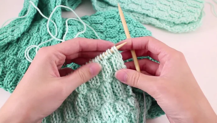 Bind off in pattern. Since the pattern starts with three knits, bind off by knitting two stitches together, then purling two stitches together, etc., following the pattern.