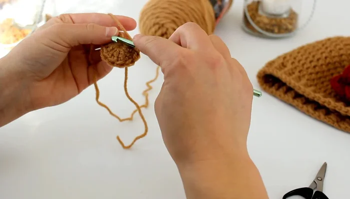 Slip stitch to the first double crochet to join.