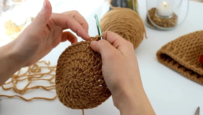 Round 5: Chain 2, then *(2 double crochet in one stitch), (1 double crochet in the next three stitches)* repeat from * to * around.