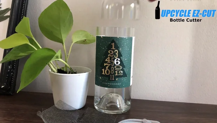 Cut the wine bottle approximately 3/4 of the way up. Ensure the cut is high enough to accommodate your plants.