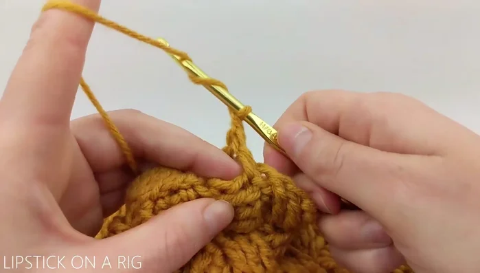 To add more yarn, yarn over twice with old yarn, insert hook in next stitch, grab new yarn and yarn over with new yarn to finish the triple crochet.