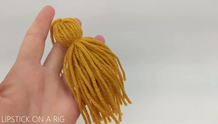 Attach four tassels to the corners.