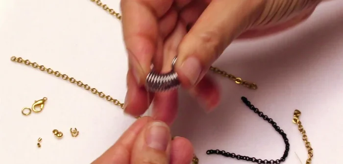 Crimp and secure one end: Attach a 2mm crimping bead, thread protector, and crimp the bead using crimping pliers. Add a 3mm crimp cover.