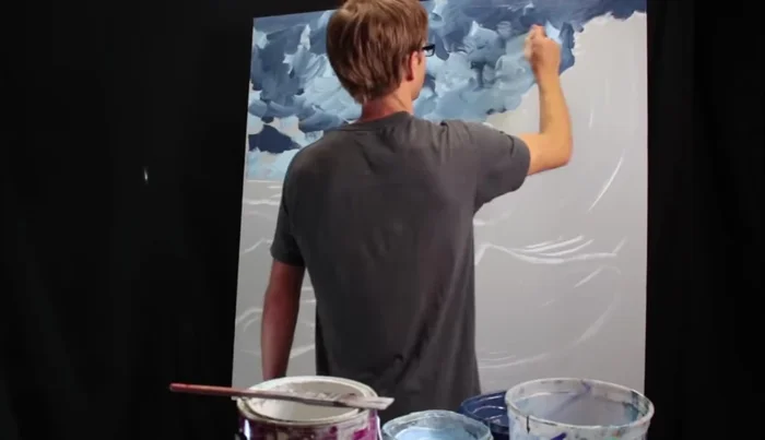 Blending Colors: Blend the dark and light colors, pulling the dark color upwards and the light color downwards to create a smooth transition.