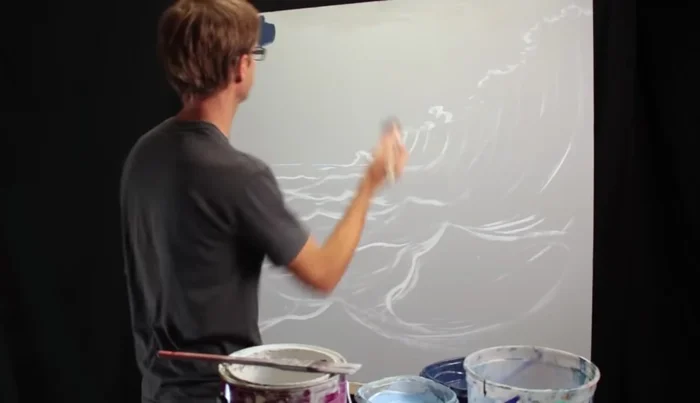 Applying Base Colors: Start by applying dark blue to the areas of the ocean, leaving lighter areas near the horizon for blending.