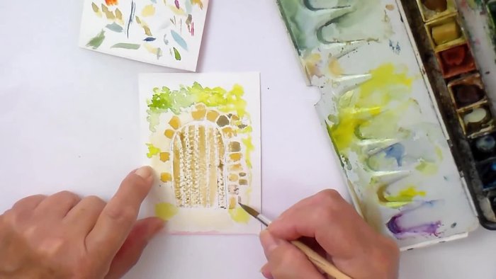 Sketch the garden gate and surrounding stone wall with pencil.