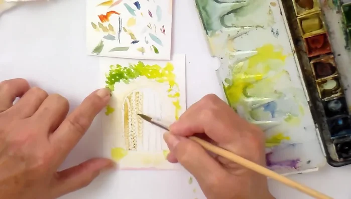 Apply a first layer of raw umber to the planks of the gate.