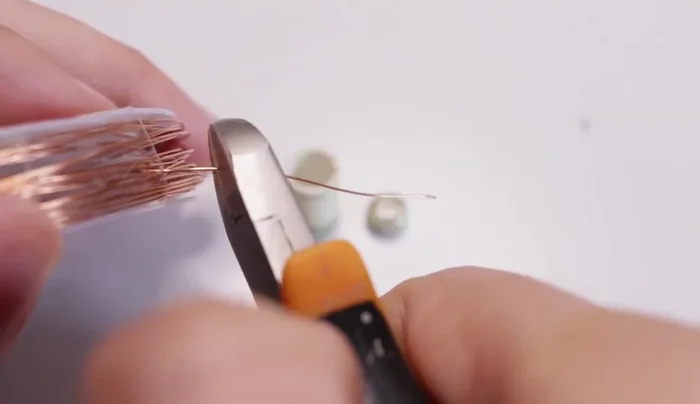 Metal parts: Cut and shape thin copper wire to join the canister and lid. Add glue to secure the ends.