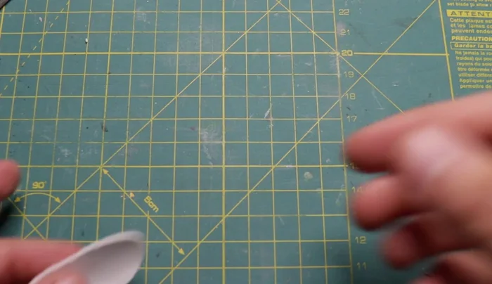 Prepare polymer clay: Flatten a layer of white polymer clay (around 1mm thick) using a pasta machine.