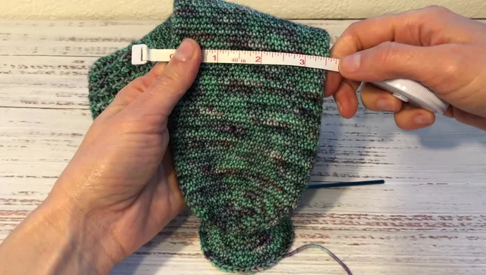 Continue crocheting in the round until the sock measures about 7 inches around.