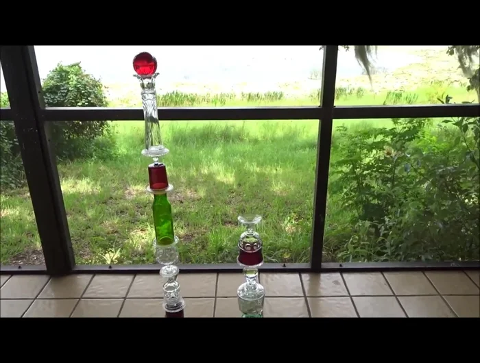 Glue the final pieces and attach the large marble to the top.