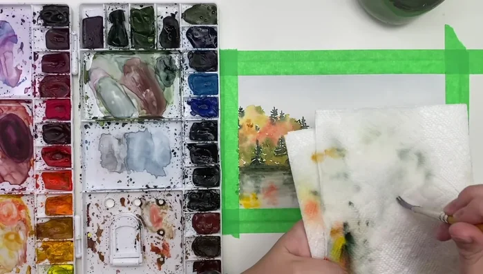 Add highlights: Use white ink to add highlights along the shoreline and in the water.