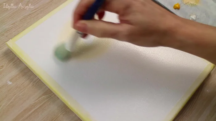 Create a purple-blue color by mixing ultramarine, pink, and a touch of white; use this to paint around the sunrise area and soften the edges.