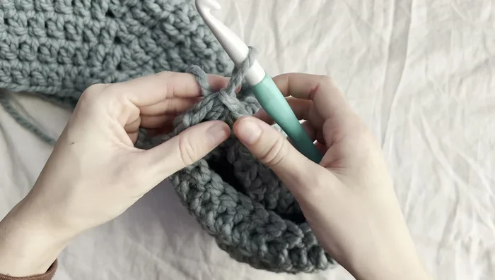 Slip stitch, tie off, and weave in ends. Repeat for the second sleeve.