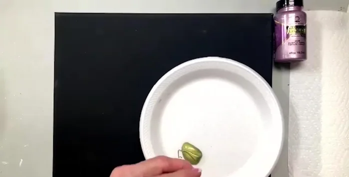 Add purple topaz paint, using the same brush technique. The black background makes the metallic paints stand out.