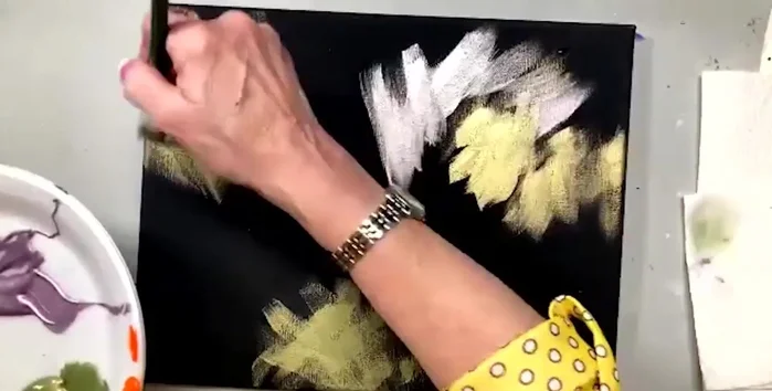 Add purple topaz paint, using the same brush technique. The black background makes the metallic paints stand out.