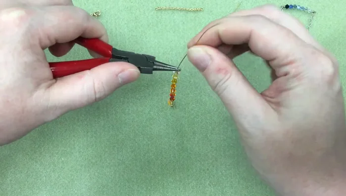 Attach the second loop to the chain. Secure with 3 wraps and trim the excess wire.