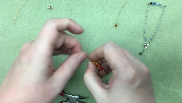 Attach the second loop to the chain. Secure with 3 wraps and trim the excess wire.