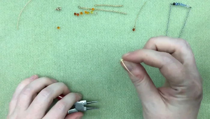 Attach the wire loop to the center of your chain using needle nose pliers for a neater finish. Secure with 3 wraps and trim the excess wire.