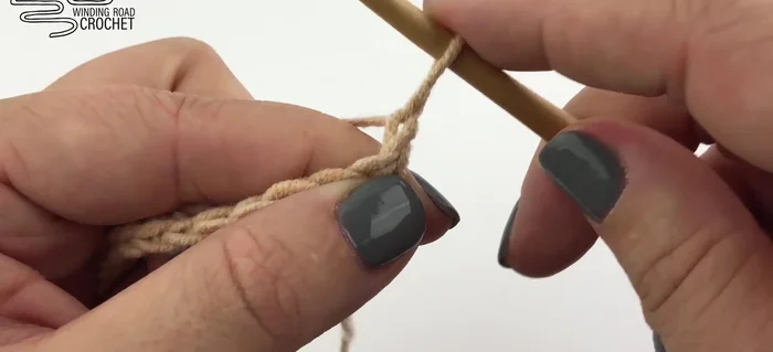 Chain one and turn. Work two double crochet into the first stitch. Chain one, skip a stitch, double crochet into the next stitch. Repeat until two stitches remain. Chain one, skip the next stitch and work two double crochet into the last stitch.