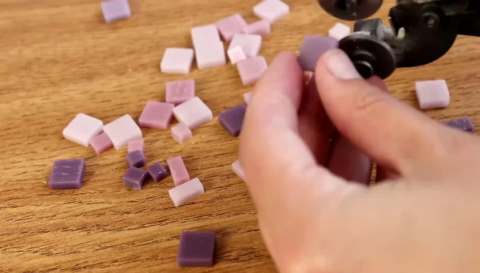 Cut tiles into halves and quarters beforehand to speed up the process.