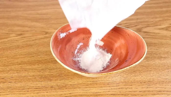 Remove excess grout with a damp cloth. Clean any grout that got on the inside of the frame.