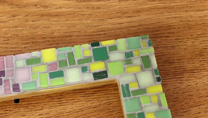 After drying, use a damp cloth to remove remaining grout residue for a neat finish.