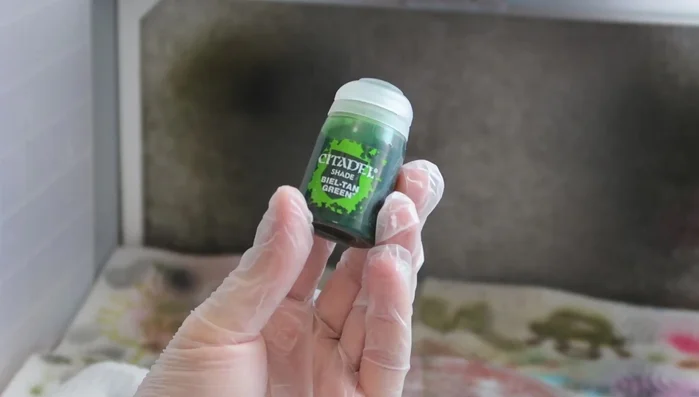 Add a gradient of darker and lighter green acrylic paints randomly.