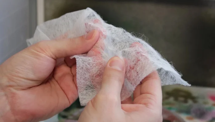 Prepare used bounce sheets: Pull them apart to create varied textures and densities.