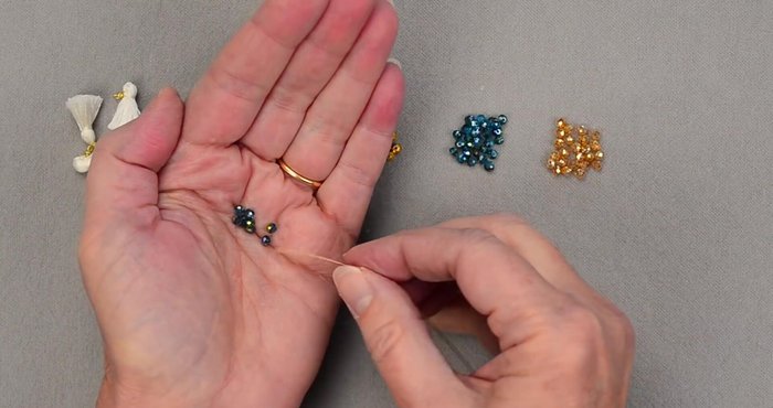 Insert tassels between the color sections of beads.