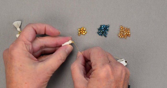 Insert tassels between the color sections of beads.
