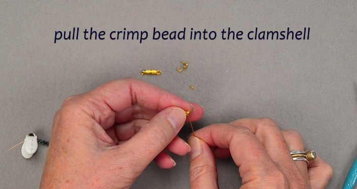 Attach the clasp to the clamshell bead tip.