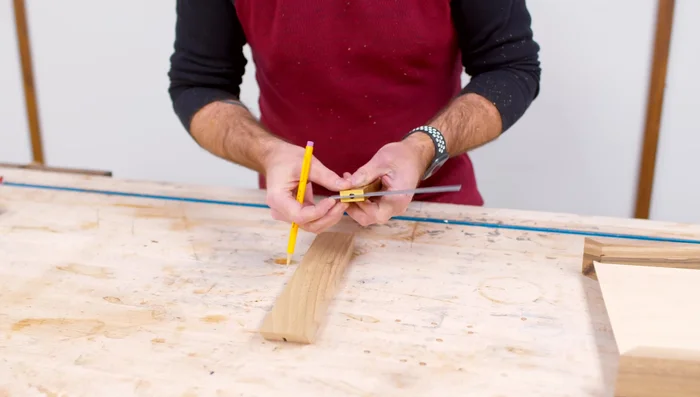 Cut the handle sections, round over the edges using a router.