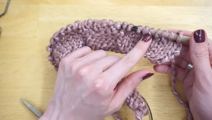 Repeat Rows 2-9 until the piece reaches 34 inches in length. Ensure you finish one row before a cable row (Row 4 or Row 8).