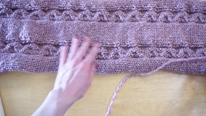 Seam the two edges together, leaving a 3-inch overlap at the top for button closure. Keep the seam close to the edge to avoid bulkiness.