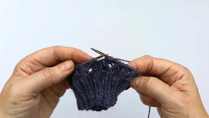 Repeating the pattern: Repeat rounds one through four until the desired sock length is achieved. Continue this pattern after the heel flap and gusset.