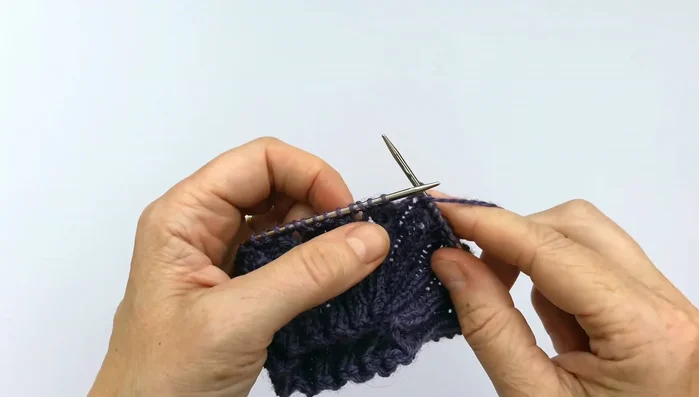 Round two: Knit the knit stitches and purl the purl stitches.