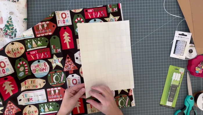 Iron fusible web onto fabric: Apply fusible web to the back of your chosen fabric. This will make the fabric stick to the paper after ironing.