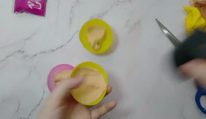 Gently remove the clay from the mold.