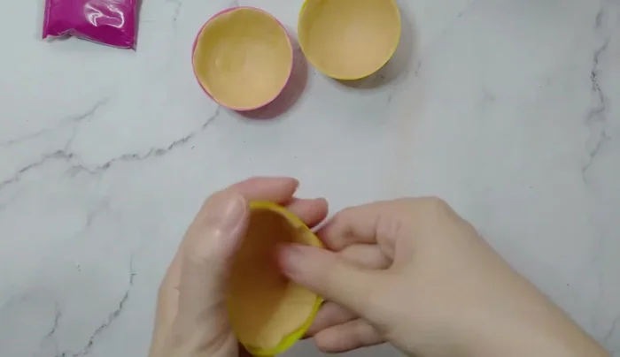 Gently remove the clay from the mold.