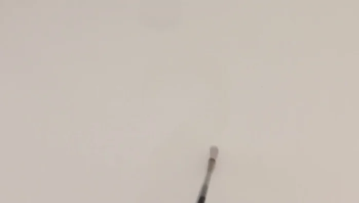 Tilt the paper to allow the ink to run and shape itself.