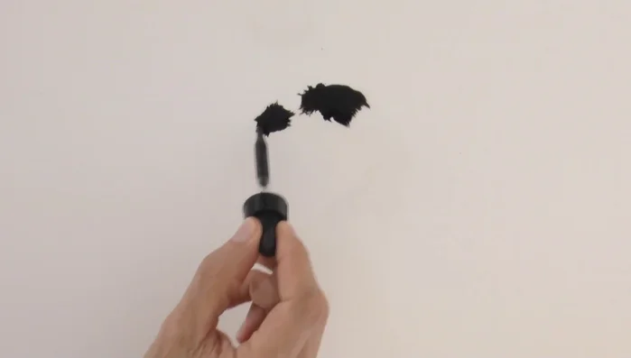 Tilt the paper to allow the ink to run and shape itself.