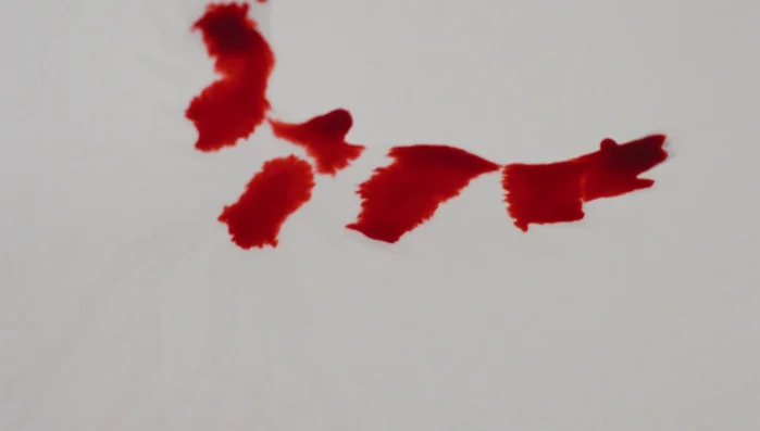 Tilt the paper to allow the ink to run and shape itself.