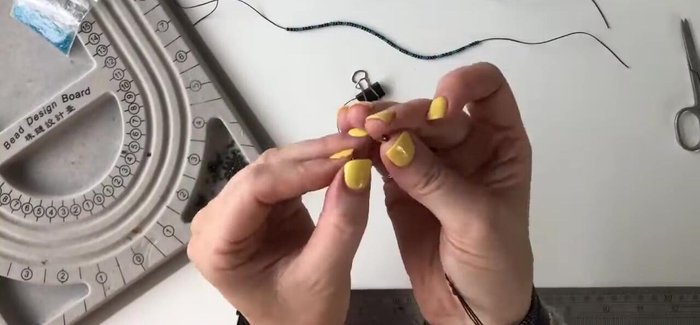 Arrange beads in your desired pattern (example: one strand of dark silver, two strands of silver/blue mix).